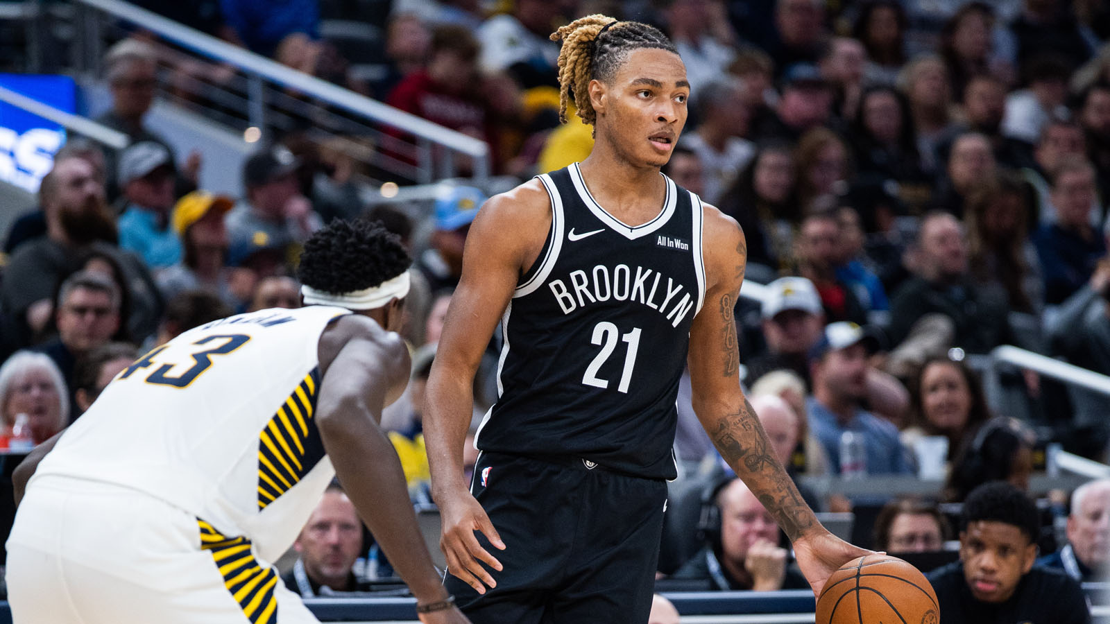 Brooklyn Nets forward/center Noah Clowney (21) dribbles the ball while Indiana Pacers forward Pascal Siakam (43) defends in the second half at Gainbridge Fieldhouse.