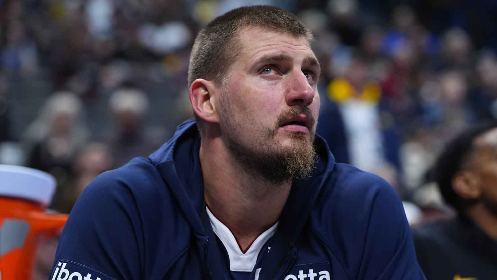 Denver Nuggets center Nikola Jokic (15) on the bench in the fourth quarter against the Indiana Pacers at Ball Arena.