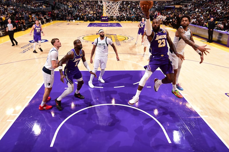 LOS ANGELES, CA - NOVEMBER 28: LeBron James #23 of the Los Angeles Lakers drives to the basket during the game aDallas Mavericks during a 2025-26 Emirates NBA Cup on November 28, 2025 at Crypto.Com Arena in Los Angeles, California. NOTE TO USER: User expressly acknowledges and agrees that, by downloading and/or using this Photograph, user is consenting to the terms and conditions of the Getty Images License Agreement. Mandatory Copyright Notice: Copyright 2025 NBAE (Photo by Adam Pantozzi/NBAE via Getty Images)