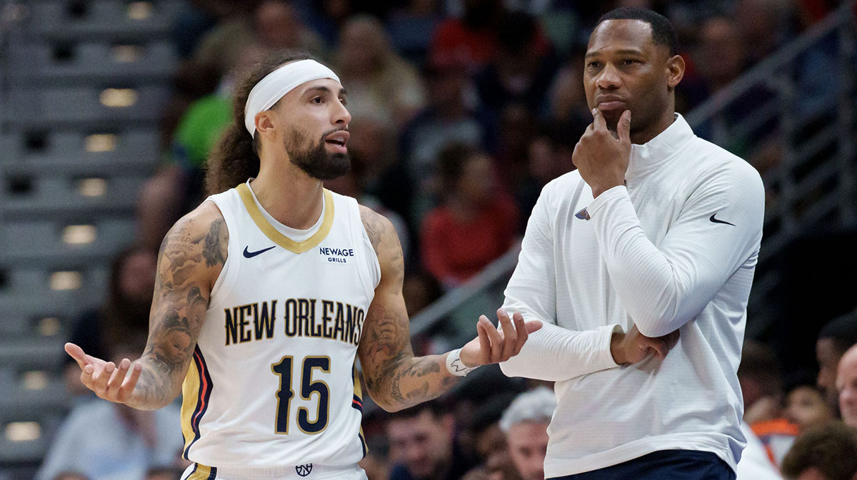 New Orleans Pelicans guard Jose Alvarado (15) talks with head coach Willie Green during the second half against the Boston Celtics at Smoothie King Center.