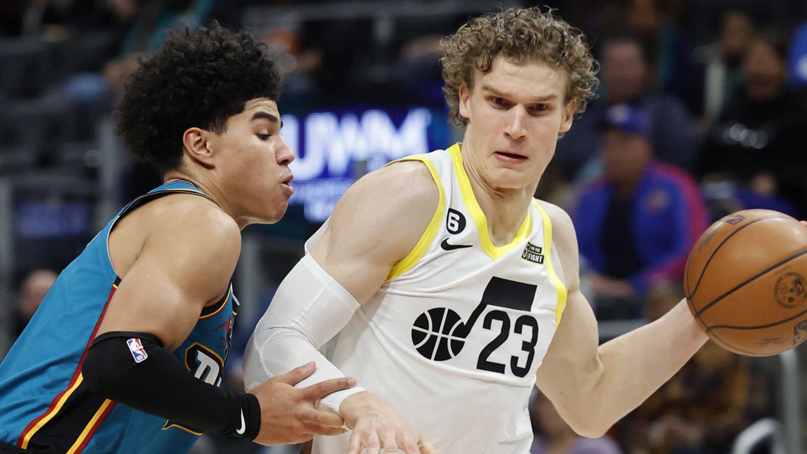 Utah Jazz forward Lauri Markkanen (23) dribbles defended by Detroit Pistons guard Killian Hayes (7) in the second half at Little Caesars Arena.