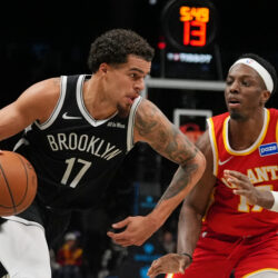Brooklyn Nets' Michael Porter Jr. (17) drives past Atlanta Hawks' Onyeka Okongwu (17) during the second half of an NBA basketball game Wednesday, Oct. 29, 2025, at Barclays Center in New York. (AP Photo/Frank Franklin II)