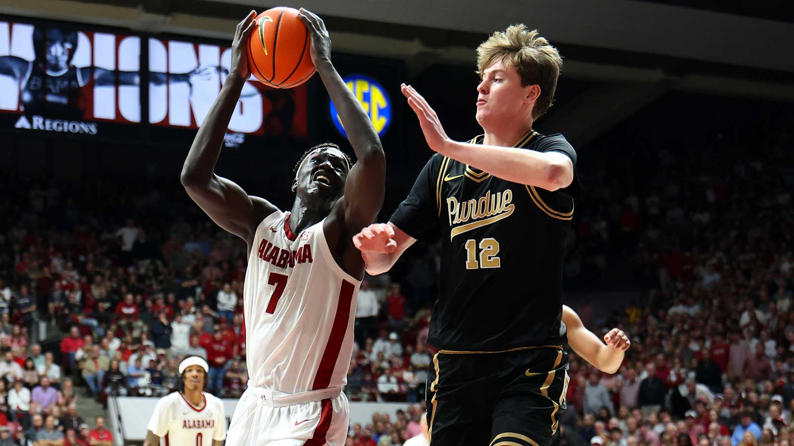 Purdue Boilermakers center Daniel Jacobsen (12) guards Alabama Crimson Tide forward Taylor Bol Bowen (7) during the second half at Coleman Coliseum.