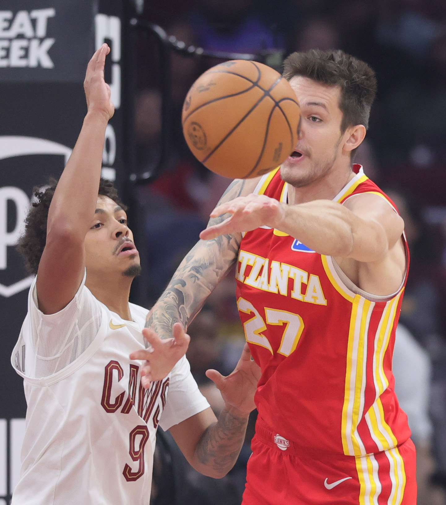 Atlanta Hawks guard Vit Krejci passes the basketball guarded by Cleveland Cavaliers guard Craig Porter Jr. in the first half at Rocket Arena. 