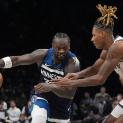Brooklyn Nets' Noah Clowney, right, defends Minnesota Timberwolves' Julius Randle during the second half of an NBA basketball game Monday, Nov. 3, 2025, at Barclays Center in New York. (AP Photo/Frank Franklin II)