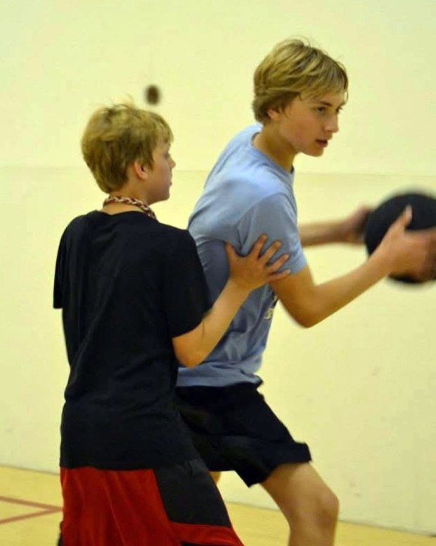 Cade Tyson, left, then 10, plays defense on his older brother Hunter Tyson, 13, during a workout while on a summer vacation to Litchfield, South Carolina in 2014. Cade, a transfer wing from North Carolina, is the Gophers' leading scorer this season, while Hunter is in his third season with the Denver Nuggets after a college career at Clemson. (Courtesy of Torri Tyson)