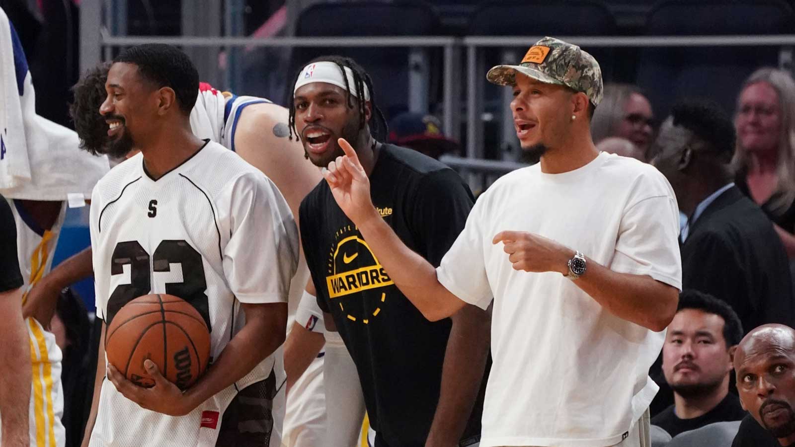 Golden State Warriors guard De'Anthony Melton (8), guard Buddy Hield (7), and guard Seth Curry (31) cheer from the bench during a game against the Los Angeles Lakers in the fourth quarter at Chase Center.