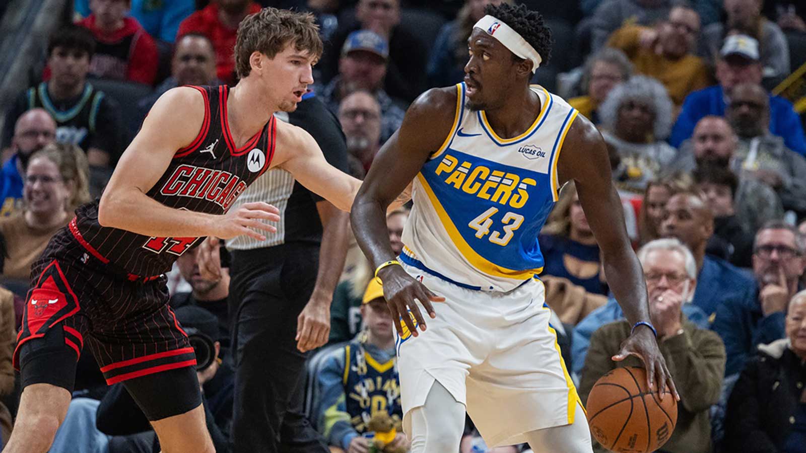 Indiana Pacers forward Pascal Siakam (43) dribbles the ball against Chicago Bulls forward Matas Buzelis (14) during the first half at Gainbridge Fieldhouse.