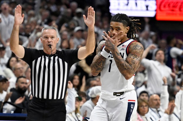 UConn guard Solo Ball (1) gestures after making a basket in the first half of an NCAA college basketball game against Arizona, Wednesday, Nov. 19, 2025, in Storrs, Conn. (AP Photo/Jessica Hill)