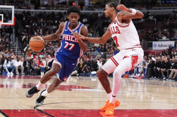 Philadelphia 76ers guard Vj Edgecombe, left, drives as Chicago Bulls forward Dalen Terry guards during the second half of an NBA basketball game in Chicago, Tuesday, Nov. 4, 2025. (AP Photo/Nam Y. Huh)