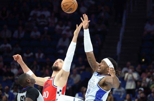 LA center Ivica Zubac (40) and Orlando center Wendell Carter...