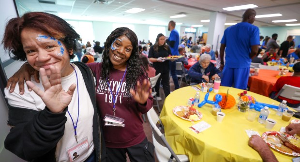 A THANKSGIVING TRADITION — Carla Williamson and Algina Lowe enjoy...