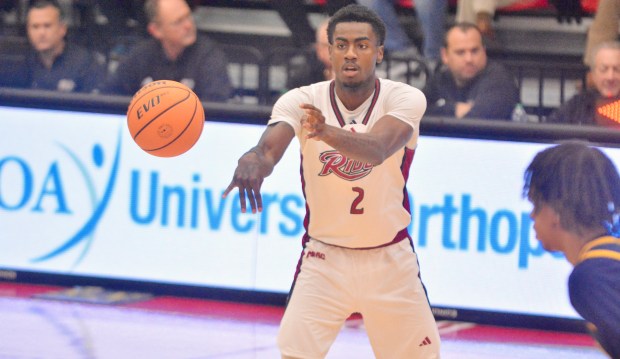 Rider’s Caleb Smith passes the ball against Copping State during...
