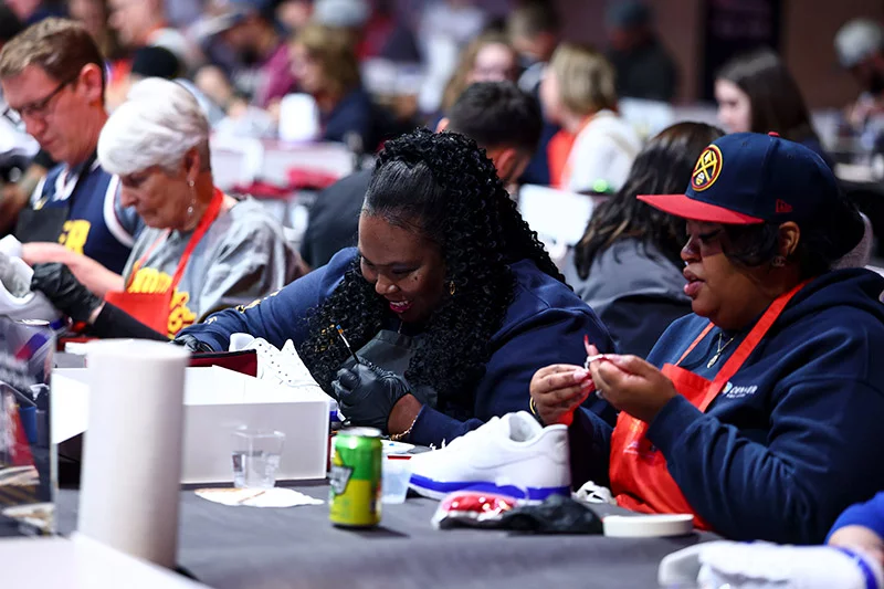 Nuggets fans loved unleashing their creativity as they painted shoes and added embellishments during Sole Connections. Clarkson Creative Photography, for UCHealth.
