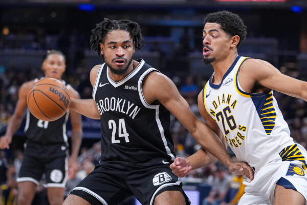 Brooklyn Nets guard Cam Thomas (24) drives on Indiana Pacers guard Ben Sheppard (26) during the first half of an NBA basketball game in Indianapolis, Wednesday, Nov. 5, 2025. (AP Photo/Michael Conroy)
