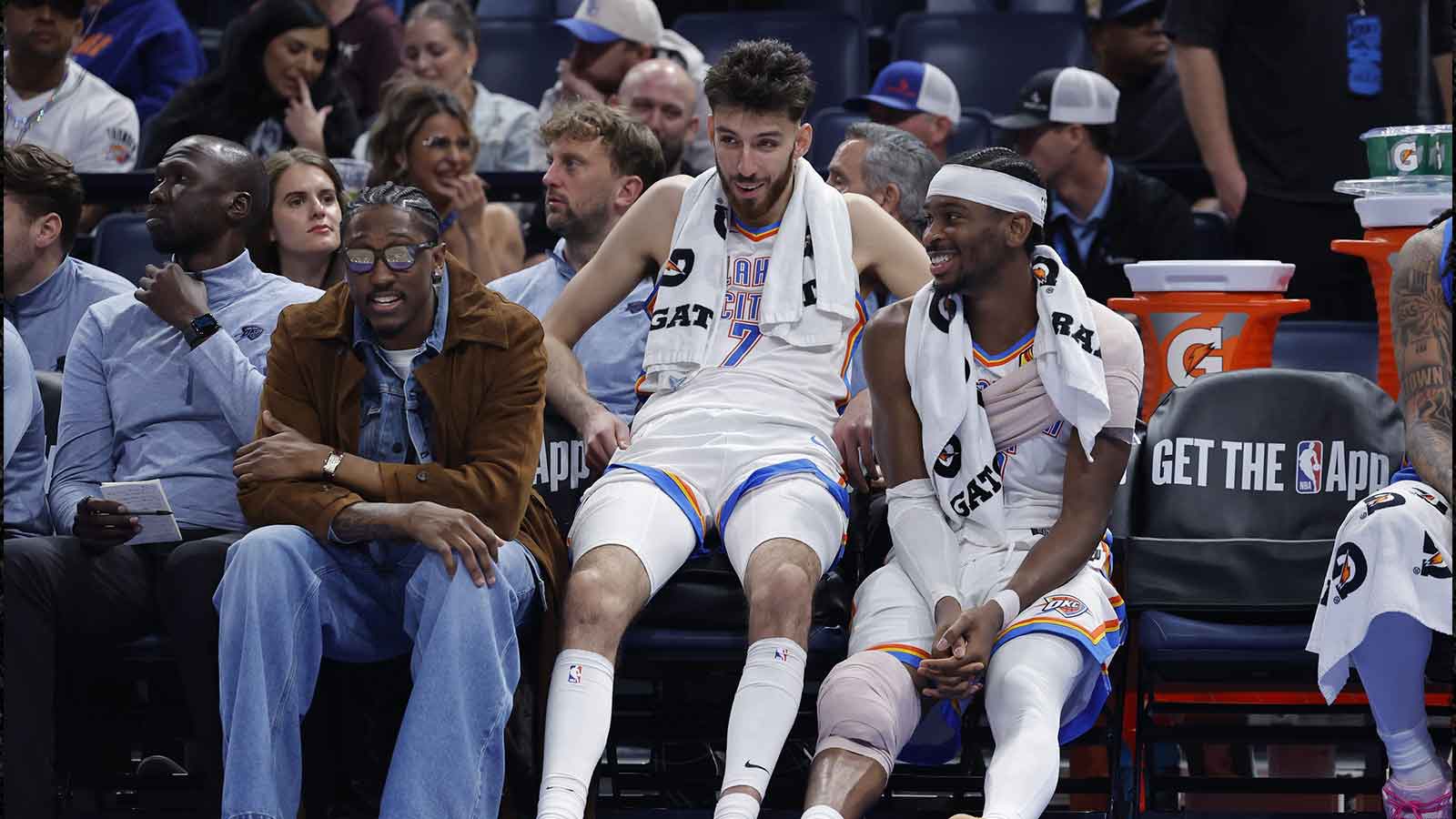 Thunder guard Jalen Williams (8), center Chet Holmgren (7), and guard Shai Gilgeous-Alexander (2) talk while sitting on the bench during the fourth quarter against the Los Angeles Lakers at Paycom Center