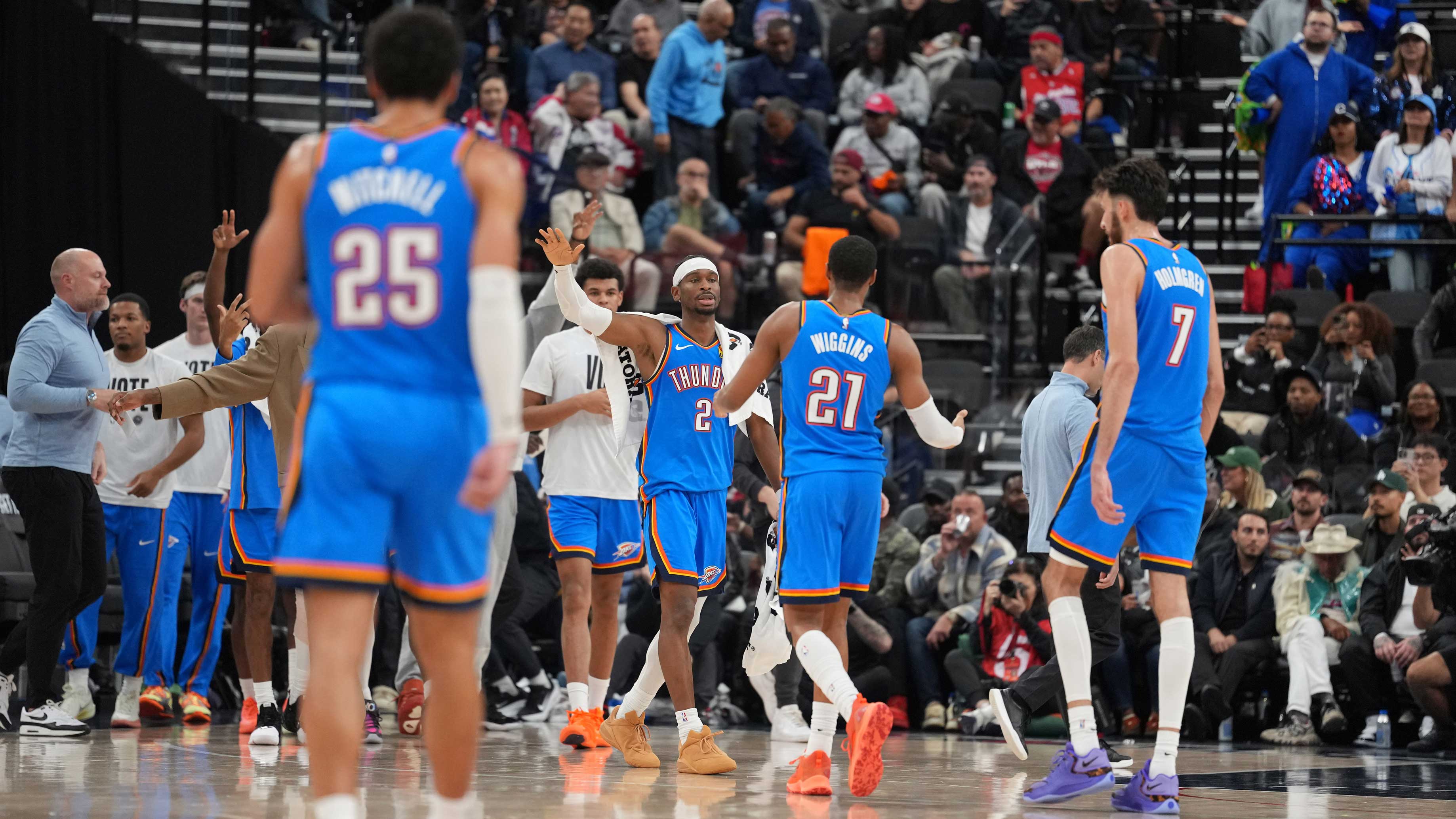 Thunder guard Shai Gilgeous-Alexander (2), guard Aaron Wiggins (21) and center Chet Holmgren (7) celebrate against the LA Clippers in the second half at Intuit Dome