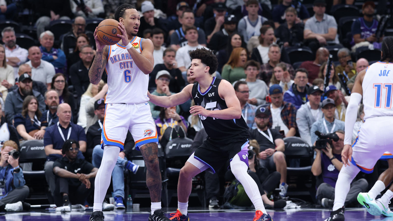 Thunder forward Jaylin Williams (6) looks for a play against Utah Jazz guard Walter Clayton Jr. (13) during the second half at Delta Center