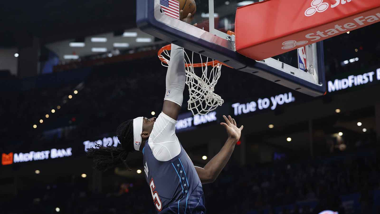 Thunder guard Luguentz Dort (5) goes to the basket against the Sacramento Kings during the second half at Paycom Center