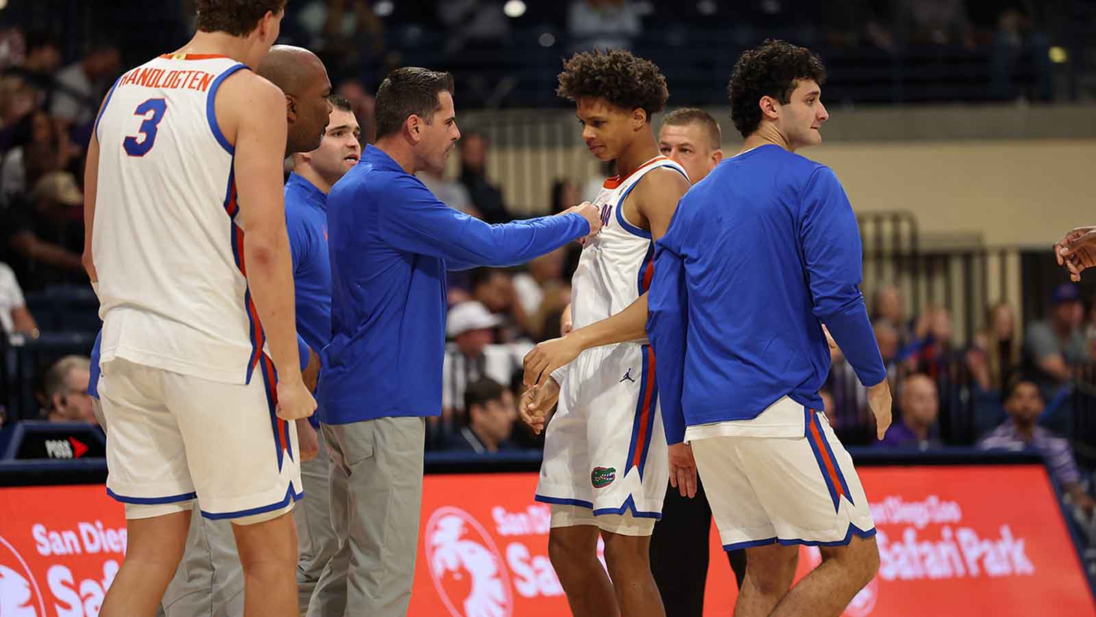 Florida Gators head coach Todd Golden reacts after the play with Florida Gators guard Alex Lloyd (4) against the Texas Christian University Horned Frogs during the first half at Jenny Craig Pavilion.