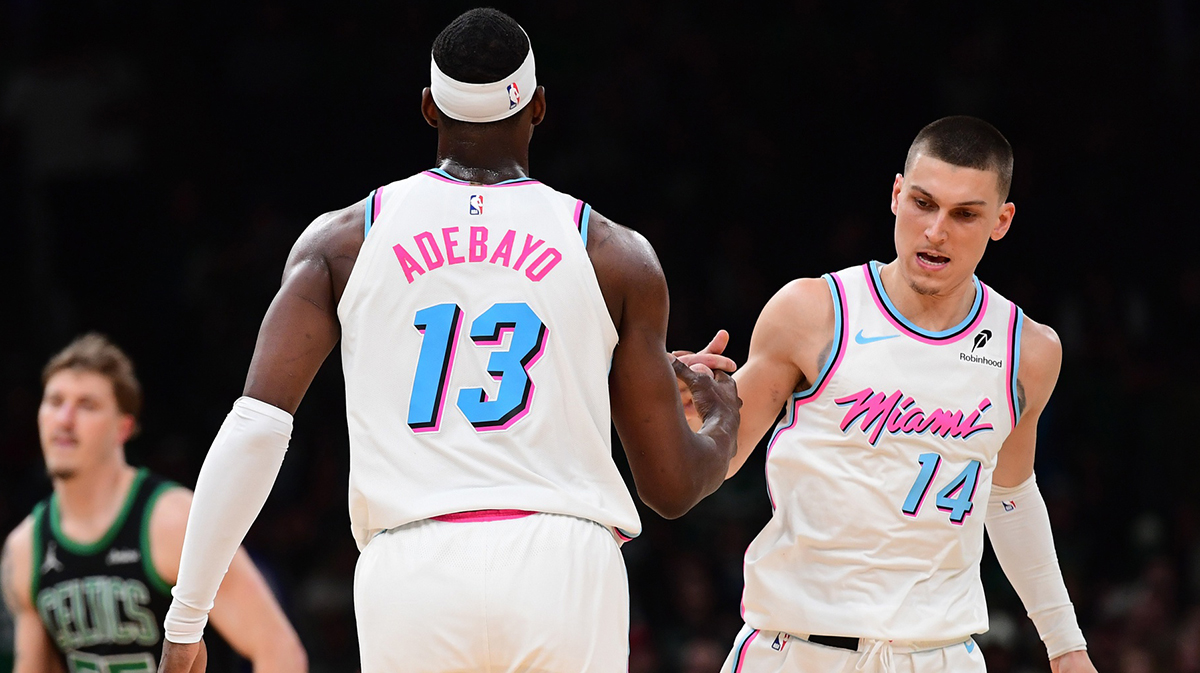 Miami Heat center Bam Adebayo (13) is congratulated by guard Tyler Herro (14) after making a basket during the second half against the Boston Celtics at TD Garden.