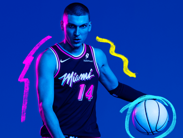 Heat guard Tyler Herro models the team's 2025-26 City Edition Vice Nights jersey. (Miami Heat courtesy)