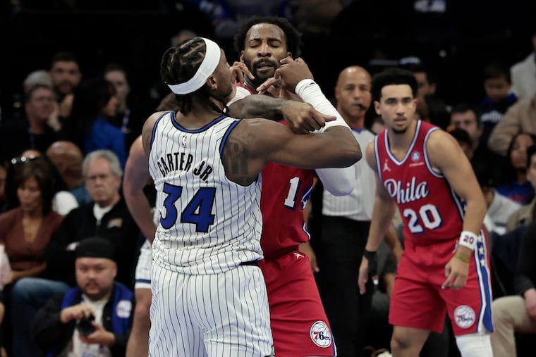 Sixers Andre Drummond and Magic’s # 34 Wendell Carter Jr. get into a tussle just before the half of the Orlando Magic at Philadelphia 76ers NBA game at Xfinity Mobile Arena in Philadelphia on Tuesday, Nov. 25, 2025.