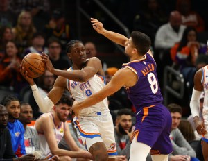 Mar 3, 2024; Phoenix, Arizona, USA; Oklahoma City Thunder forward Jalen Williams (8) against Phoenix Suns guard Grayson Allen (8) at Footprint Center. Mandatory Credit: Mark J. Rebilas-USA TODAY Sports