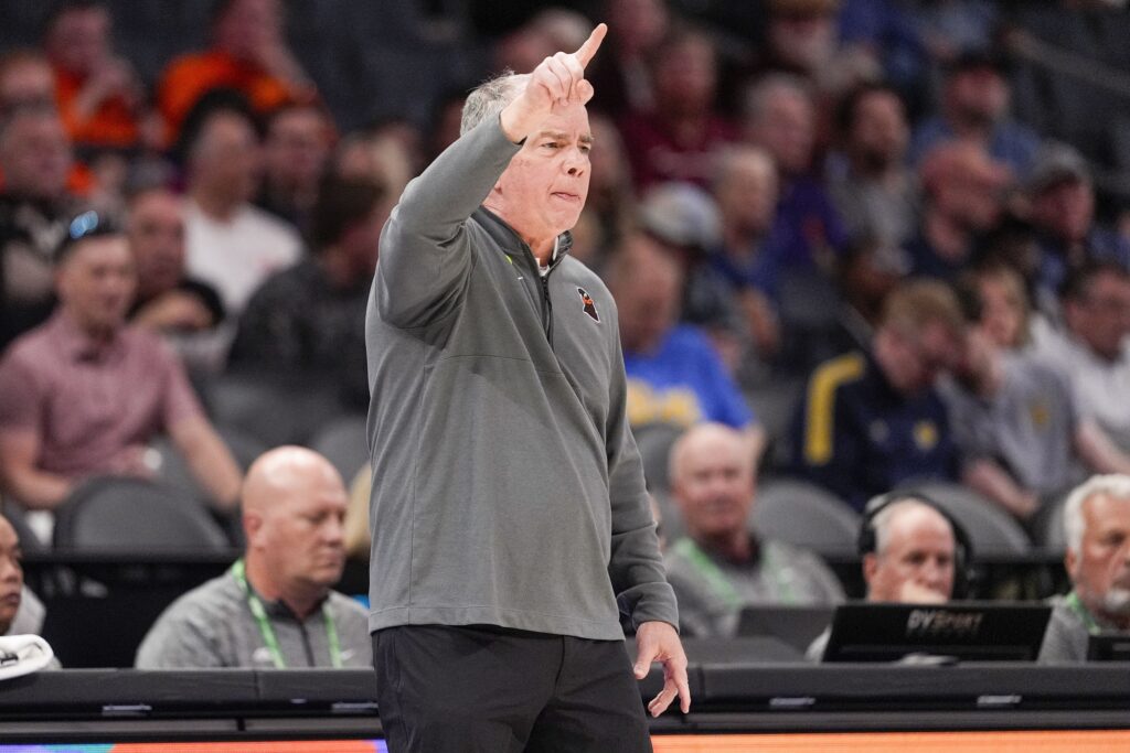 Virginia Tech Hokies head coach Mike Young signals to his team during the first half against the California Golden Bears at Spectrum Center.