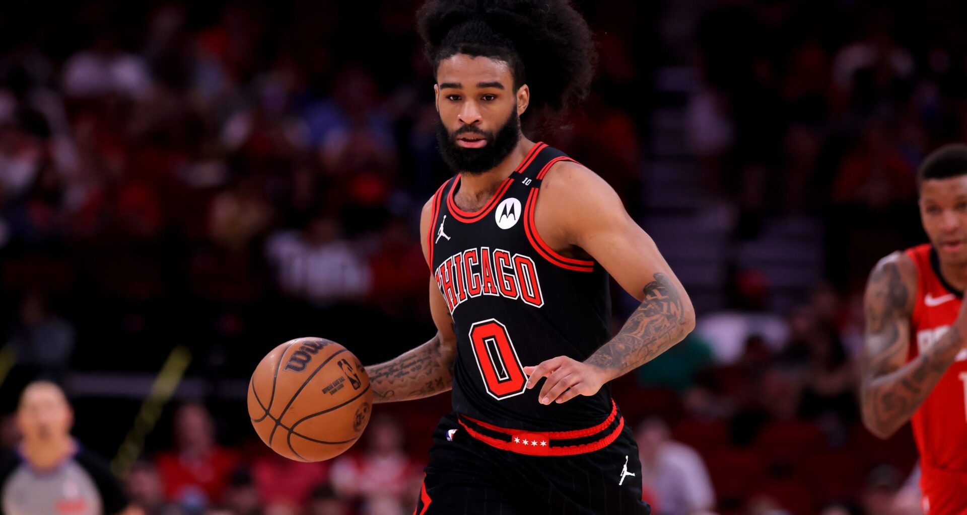 Chicago Bulls guard Coby White (0) handles the ball against the Houston Rockets during the first quarter at Toyota Center.