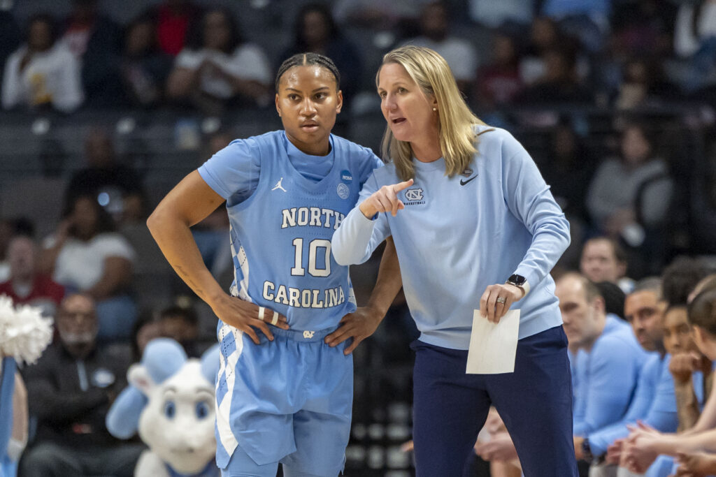 North Carolina Tar Heels head coach Courtney Banghart works with guard Reniya Kelly