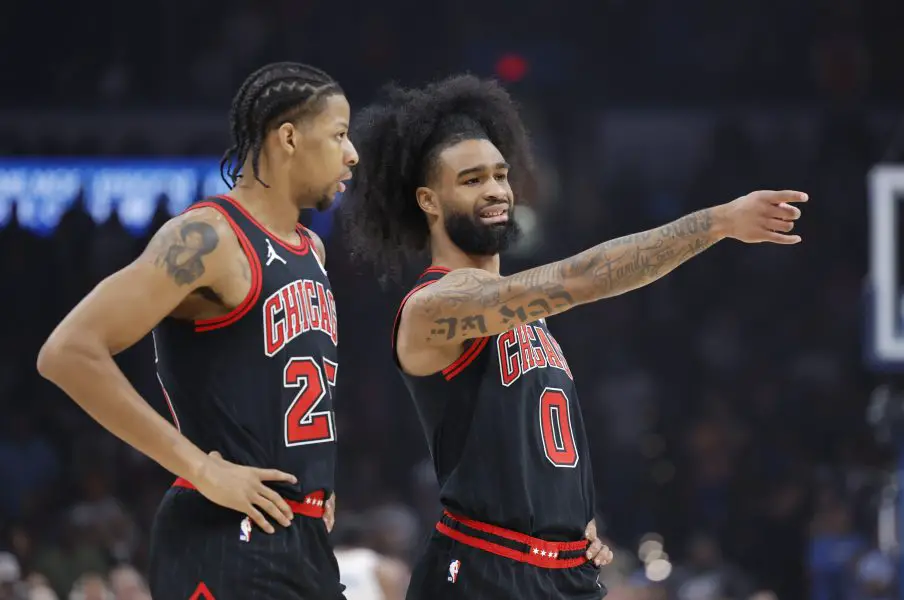 Chicago Bulls guard Coby White (0) talks to forward Dalen Terry