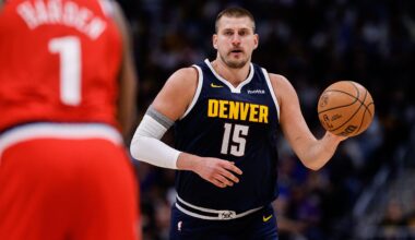 Apr 21, 2025; Denver, Colorado, USA; Denver Nuggets center Nikola Jokic (15) dribbles the ball up court against Los Angeles Clippers guard James Harden (1) in the third quarter during game two of first round for the 2025 NBA Playoffs at Ball Arena. Mandatory Credit: Isaiah J. Downing-Imagn Images