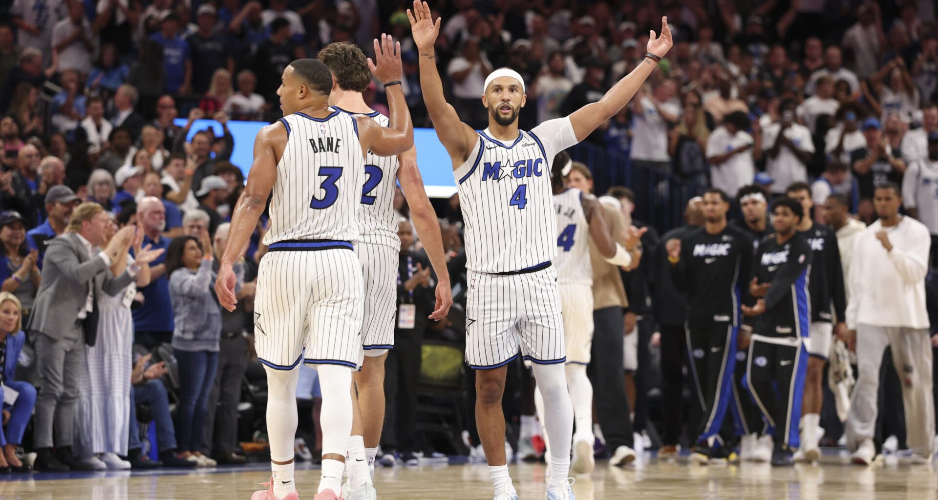 Orlando Magic players react to a play against the Miami Heat during the 2025-26 NBA season.