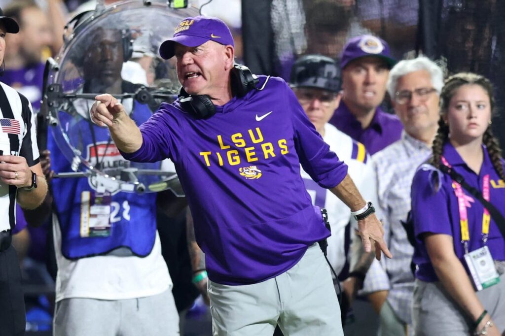 Tigers head coach Brian Kelly points from the sideline during an LSU game.