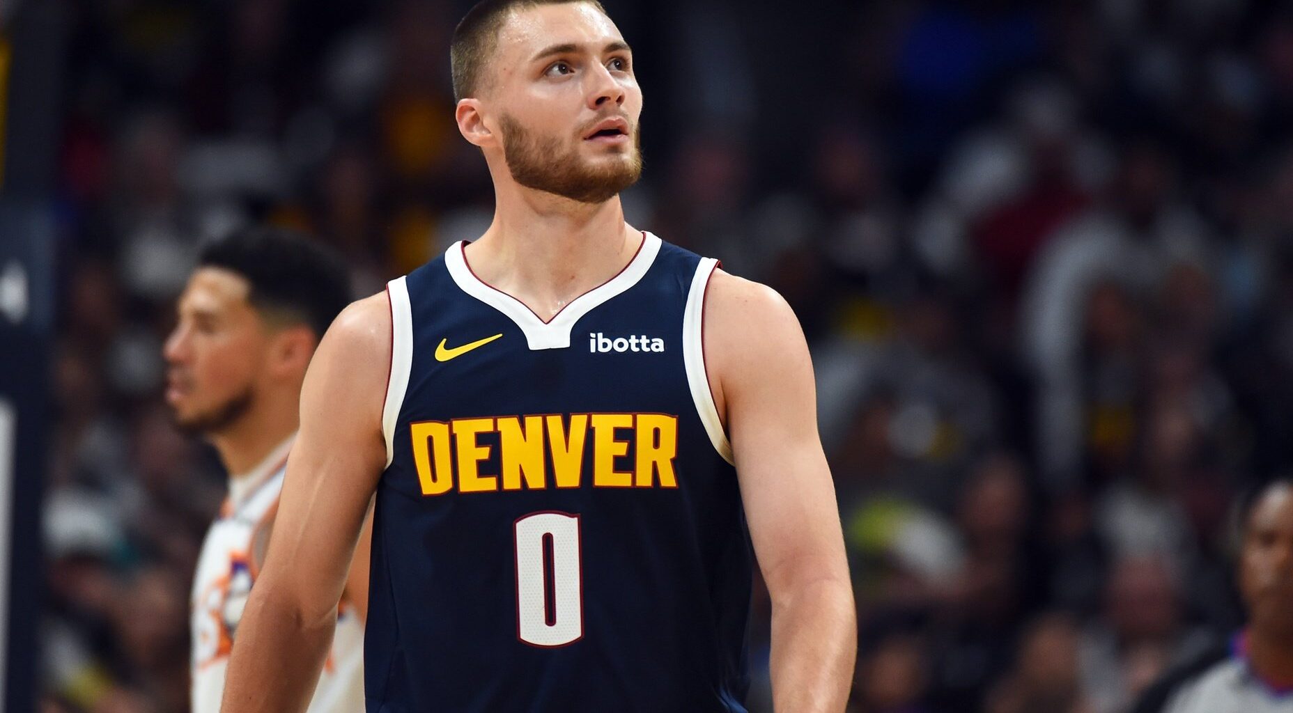 Oct 25, 2025; Denver, Colorado, USA; Denver Nuggets guard Christian Braun (0) walks back to the bench after a play during the first half against the Phoenix Suns at Ball Arena. Mandatory Credit: Christopher Hanewinckel-Imagn Images