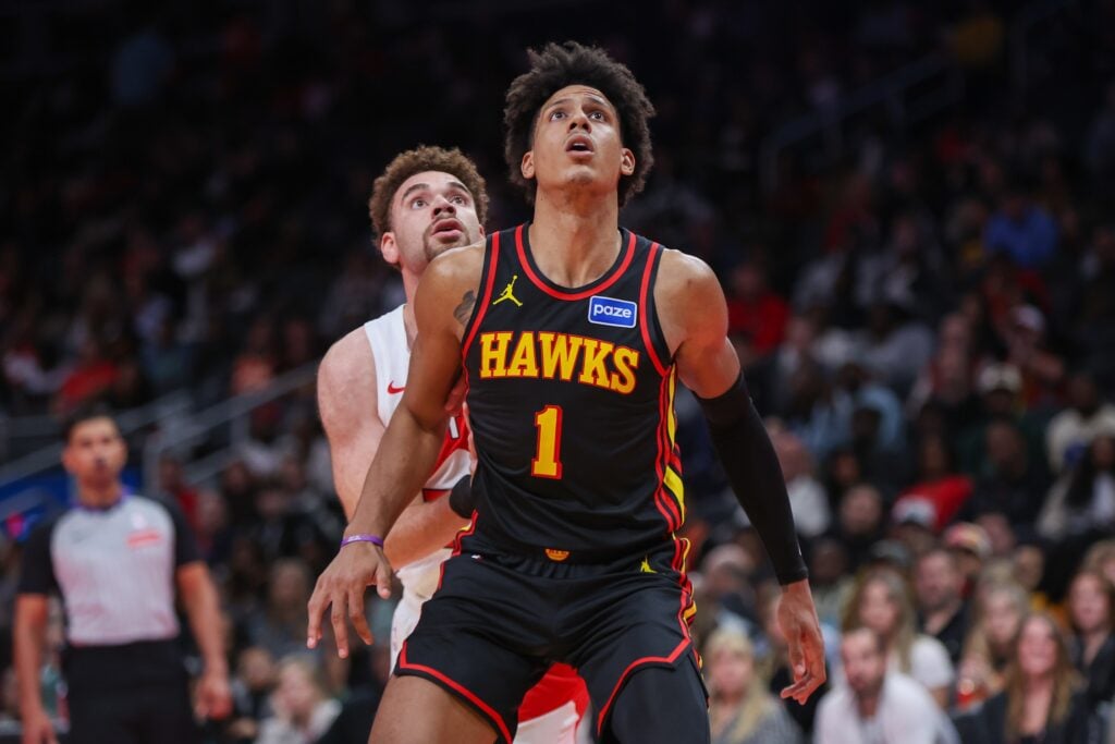 Atlanta Hawks forward Jalen Johnson (1) boxes out Toronto Raptors forward Jamison Battle (77) in the fourth quarter at State Farm Arena. 