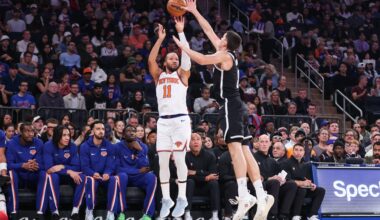 Nov 9, 2025; New York, New York, USA; New York Knicks guard Jalen Brunson (11) takes a three point shot past Brooklyn Nets guard Egor Demin (8) in the first quarter at Madison Square Garden. Mandatory Credit: Wendell Cruz-Imagn Images