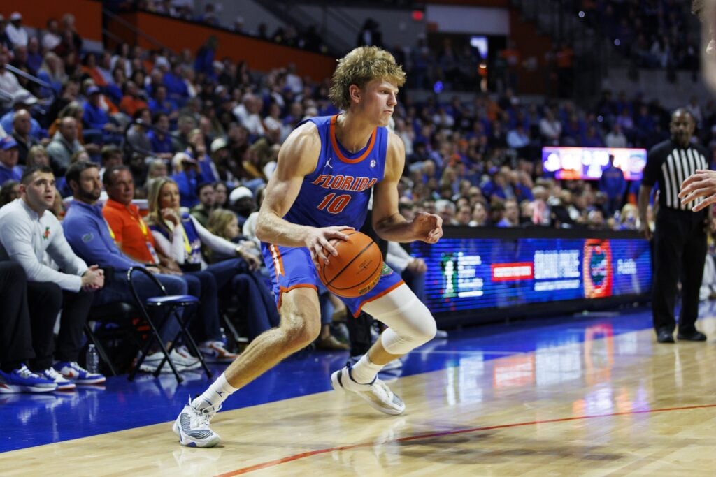  Florida Gators forward Thomas Haugh (10) dribbles the ball against the Florida State Seminoles during the second half at Exactech Arena at the Stephen C. O'Connell Center.