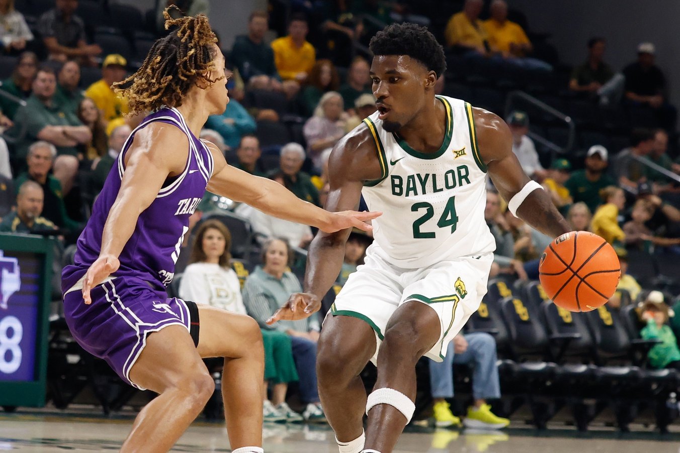 Baylor Bears guard Tounde Yessoufou (24) controls the ball as Tarleton State Texans guard Jordan Mizell (0) defends during the first half at Paul and Alejandra Foster Pavilion.