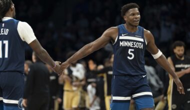 Timberwolves star Anthony Edwards high five Naz Reid during the 2025-26 NBA season.