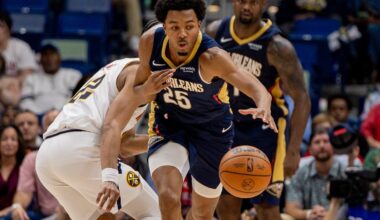 Nov 19, 2025; New Orleans, Louisiana, USA; New Orleans Pelicans forward Trey Murphy III (25) brings the ball up court against Denver Nuggets forward/center Zeke Nnaji (22) during the second half at Smoothie King Center. Mandatory Credit: Stephen Lew-Imagn Images