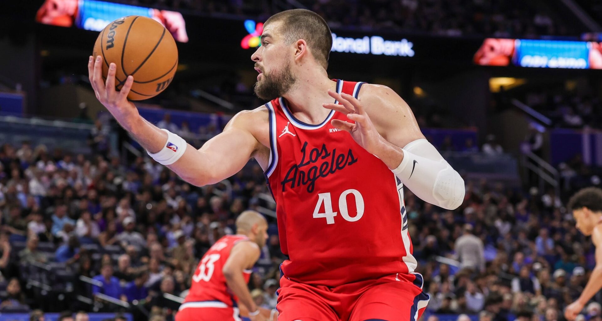 Nov 20, 2025; Orlando, Florida, USA; LA Clippers center Ivica Zubac (40) grabs the rebound during the second quarter against the Orlando Magic at Kia Center. Mandatory Credit: Mike Watters-Imagn Images