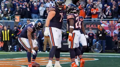 Nov 23, 2025; Chicago, Illinois, USA; Chicago Bears running back Kyle Monangai (25) reacts with offensive tackle Ozzy Trapilo (75) after scoring a touchdown against the Pittsburgh Steelers during the second half at Soldier Field.