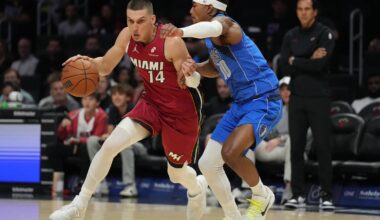 Nov 24, 2025; Miami, Florida, USA; Miami Heat guard Tyler Herro (14) drives to the basket as Dallas Mavericks guard Brandon Williams (10) defends during the first half at Kaseya Center. Mandatory Credit: Jim Rassol-Imagn Images
