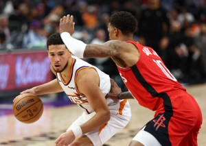 Nov 24, 2025; Phoenix, Arizona, USA; Phoenix Suns guard Devin Booker (1) against the Houston Rockets in the second half at Mortgage Matchup Center. Mandatory Credit: Mark J. Rebilas-Imagn Images