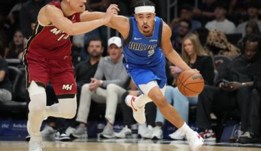 Nov 24, 2025; Miami, Florida, USA; Dallas Mavericks guard Ryan Nembhard (9) drives past Miami Heat guard Tyler Herro (14) during the second half at Kaseya Center. Mandatory Credit: Jim Rassol-Imagn Images