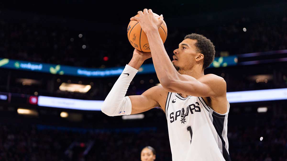 San Antonio Spurs forward Victor Wembanyama (1) shoots a three pointer against the Phoenix Sun during the second half at Mortgage Matchup Center.