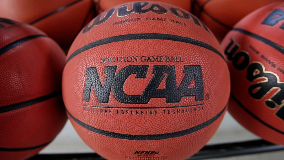 FILE - In this March 22, 2010, file photo, basketballs sit in a rack before an college...
