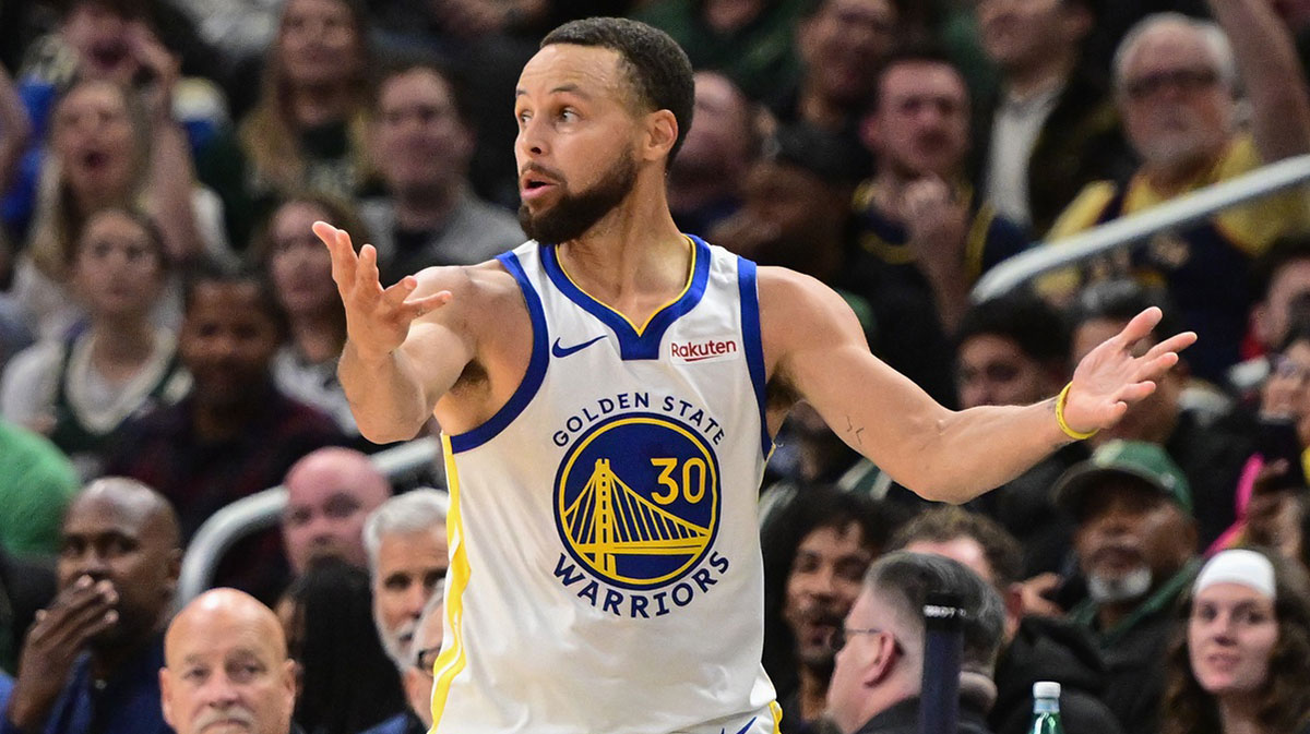 Warriors guard Stephen Curry (30) reacts in the 4th quarter against the Milwaukee Bucks at Fiserv Forum